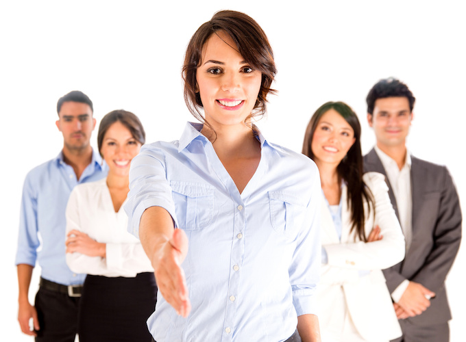 Business woman with hand extended to handshake - isolated over white